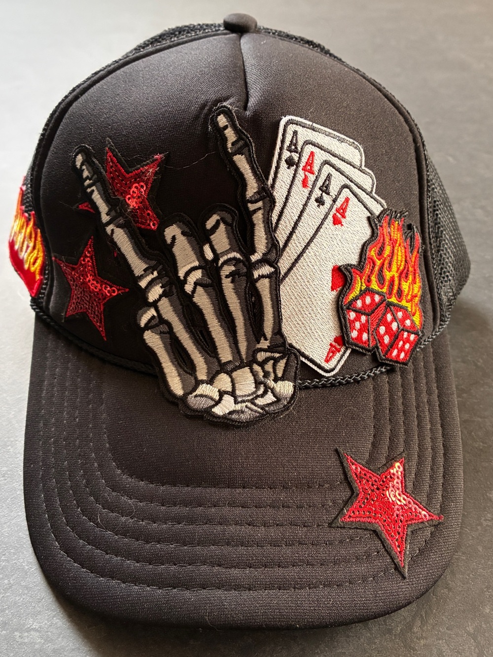 Black Embroidered Rocker Trucker Hat with Skeleton & Cards